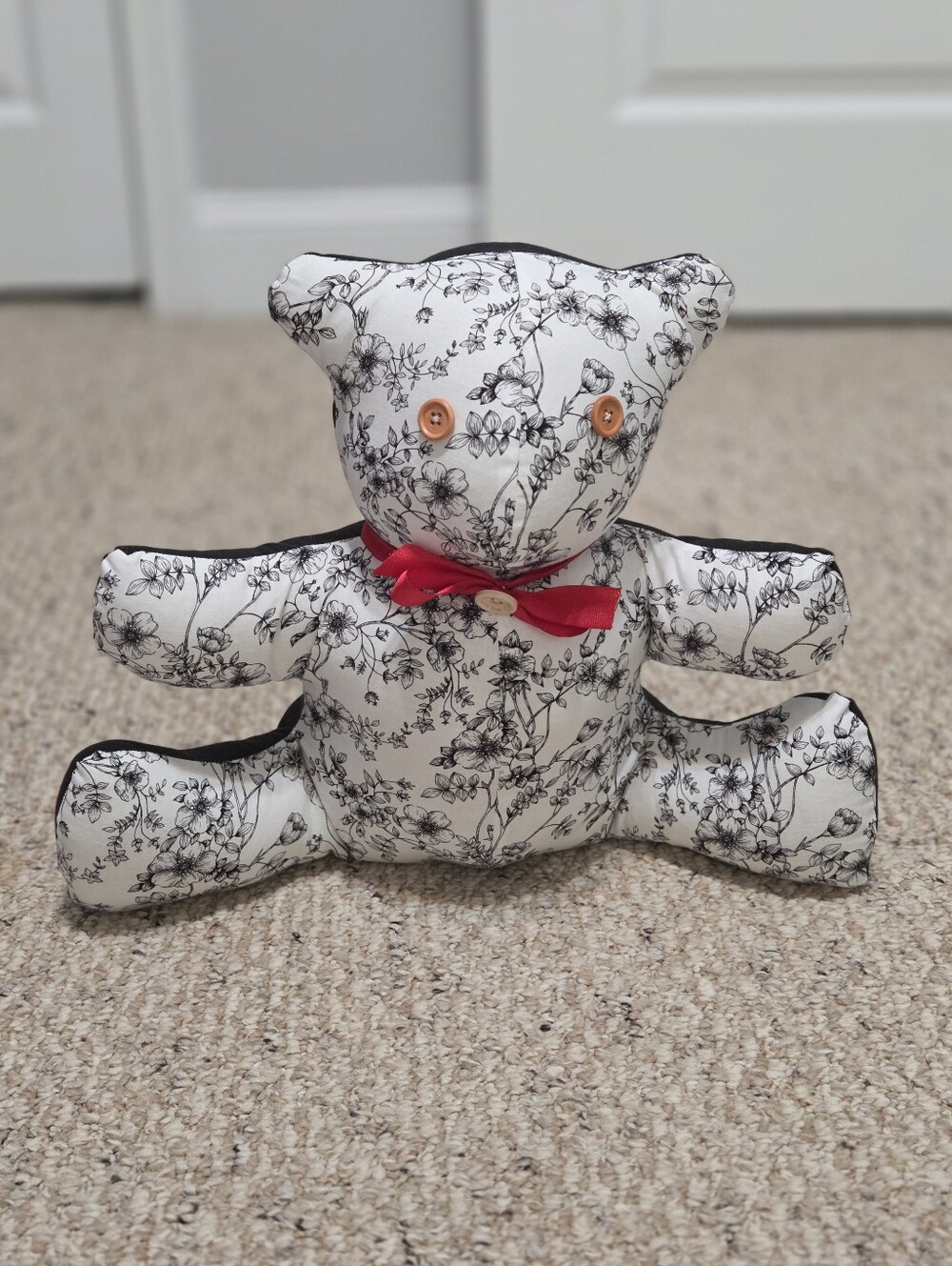 Hand Crafted Black and White Floral Bear Plush with Red Bow
